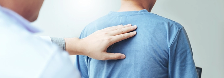 A person receiving a back exam.